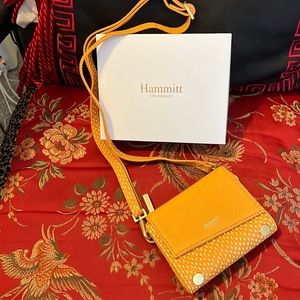 Pop of color in a Hammitt, Levy small crossbody wallet.